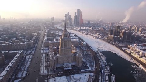Beautiful frozen WINTER Moscow city cowered in snow and ice. Stalin skyscraper. Aerial FPV Drone Flights. UltraHD 4K