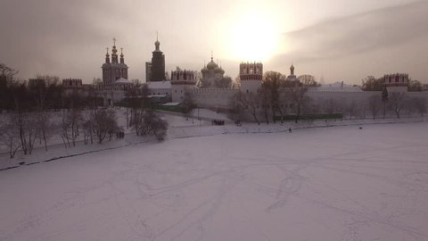 Novodevichy convent. Russian churches. Beautiful frozen WINTER Moscow city cowered in snow and ice. Aerial FPV Drone Flights. UltraHD 4K