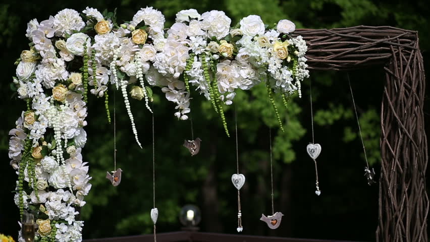 Beautiful arch is decorated with flowers and toys
