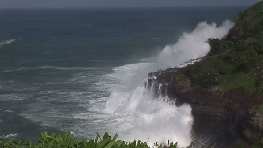 Rough Surf Breaking On Rocky Volcanic Hawaiian Coastline