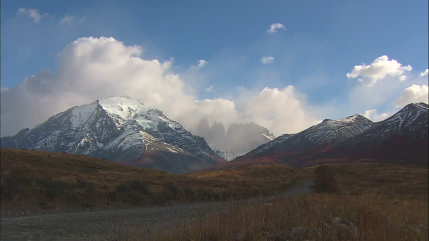 Cuernos Del Paine With Red Hills and Snow Capped Peaks