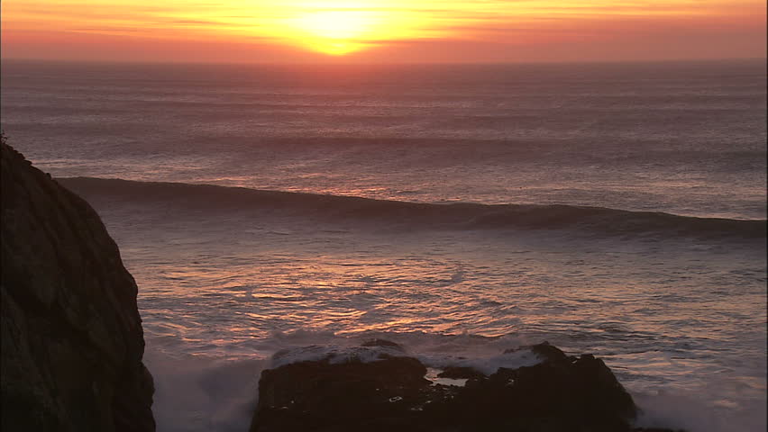 Pacific Coast Sunset With Large Rolling Waves and Mares Tails With Seals and