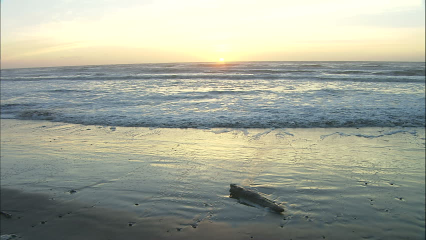 Pacific Coast Sunset Reflected in Gently Beach Surf