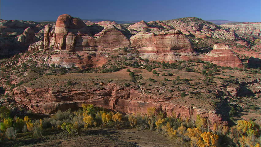 Colorado River Valley In Fall With Cliffs And Rock Formations In Background