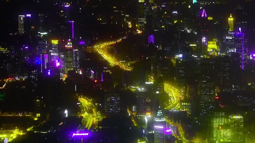 Elevated view of urban traffic & brightly lit high-rise buildings at night in Shanghai,China,time lapse.  gh2_07623