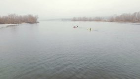 Aerial view of athlete rowing in a kayak. Winter. Ice