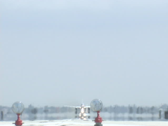 A jet takes off from an airport runway.