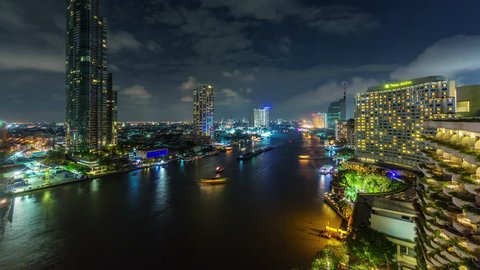 BANGKOK, THAILAND - JANUARY 2016: city night light chao phraya traffic river hotel bay roof top 4k time lapse circa january 2016 bangkok, thailand.