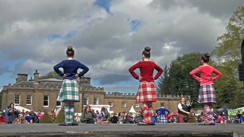 FOCHABERS / SCOTLAND - MAY 17 2015 : Local folks performing the traditional highland dancing on stage