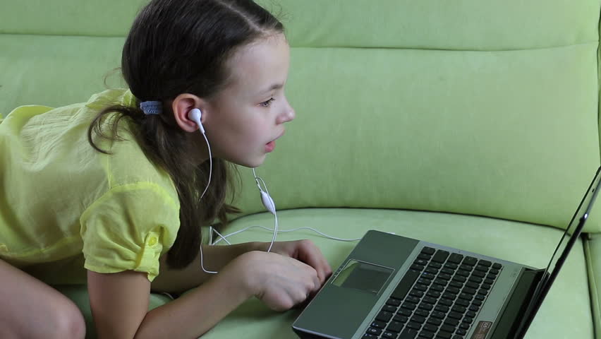 Beautiful emotional girl listening to song on laptop and sings. | Shutterstock HD Video #14678140