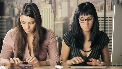 Business women worried about recession working with tablet and pc