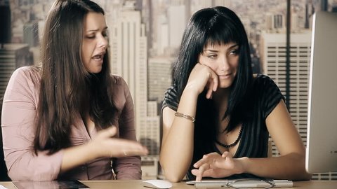 Female boss businesswoman angry with young coworker in office