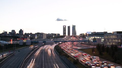 Time lapse skyline sunset city of Madrid with road and buildings