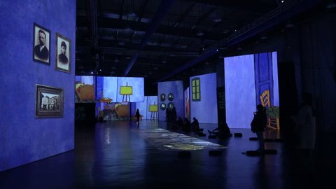 HANGZHOU, CHINA - 11 NOVEMBER 2015: Exhibition of Vincent van Gogh paintings on large screens in a Chinese art gallery in Hangzhou. 