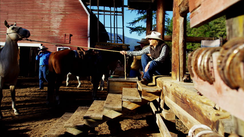 Female Cowgirl working with horse on Dude Ranch Canada