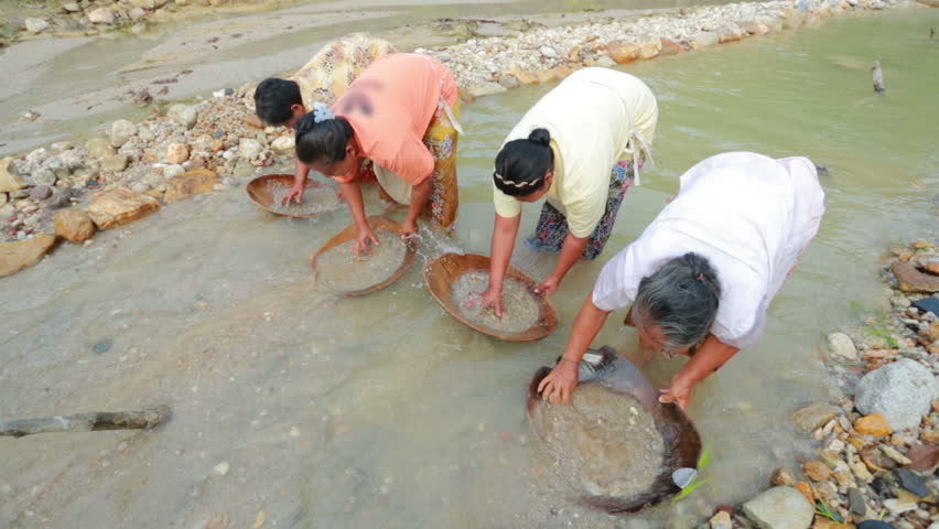 gold panning in a small stream in south of Thailand