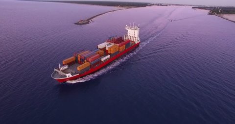 4K - To follow the cargo ship. Aerial view
