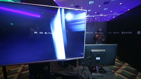 LOS ANGELES - JAN 23: VR enthusiast tries "Raw Data" at the Virtual Reality Los Angeles Winter Expo on Jan 23, 2016 in Los Angeles. The room scale android survival game is made by Survivors.