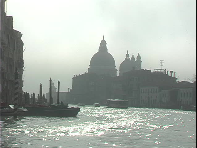 A water-taxi floats down the Grand Canal towards St. Mark