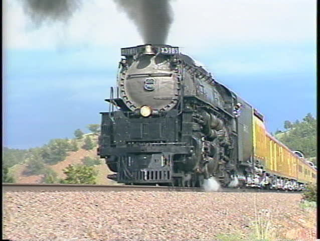 Tracking-left shot of a Union Pacific steam passenger train.