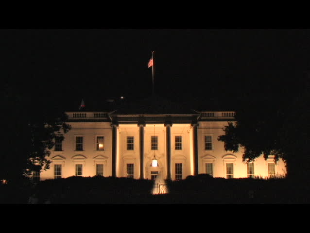 Long-shot of the Washington Monument through the pillars of the Lincoln Memorial.