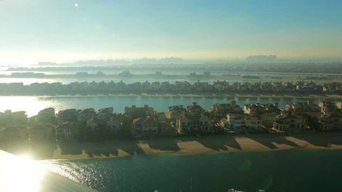 Premium lifestyle real estate. Panoramic view from the air on Palm Jumeirah Dubai 2016. Panoramic view from the air on premium real estate and yachts. Stylish houses are built on artificial island.
