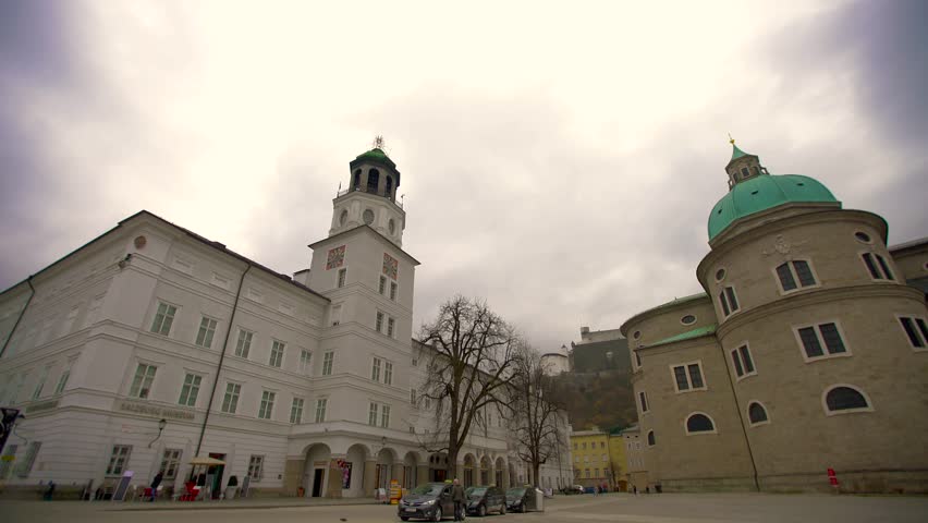 SALZBURG - FEBRUARY 18: Residence Square or Residenzplatz in Salzburg on cloudy winter day surrounded by the Cathedral, the New and the Old residence February 18, 2016 in Salzburg, Austria. 
