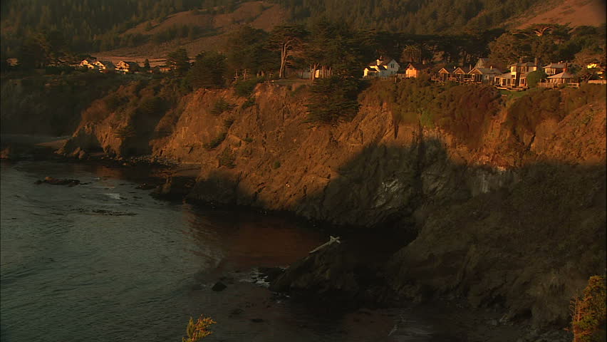 Warm Afternoon Sunlight Against Quaint Cliff Perched Coastal Town