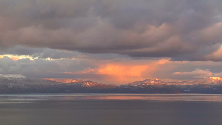 Orange Backlit Clouds At Sunset Over Lake Tahoe and Sierra Nevada Mountain Range