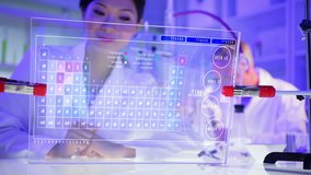 Asian female scientist using touchscreen technology for analysis in laboratory - Powered by Shutterstock - Get 15% off with code: PIKWIZARD15