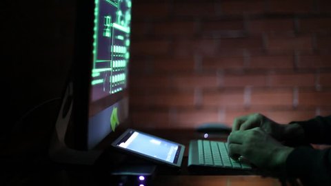 Man working with computer, hacking and writing