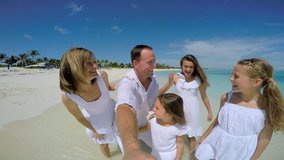  POV GoPro video of Caucasian family outdoor on a luxury beach