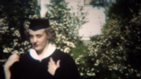 SAN FRANCISCO, CALIFORNIA 1949: College graduate in classic black and white gown and cap.