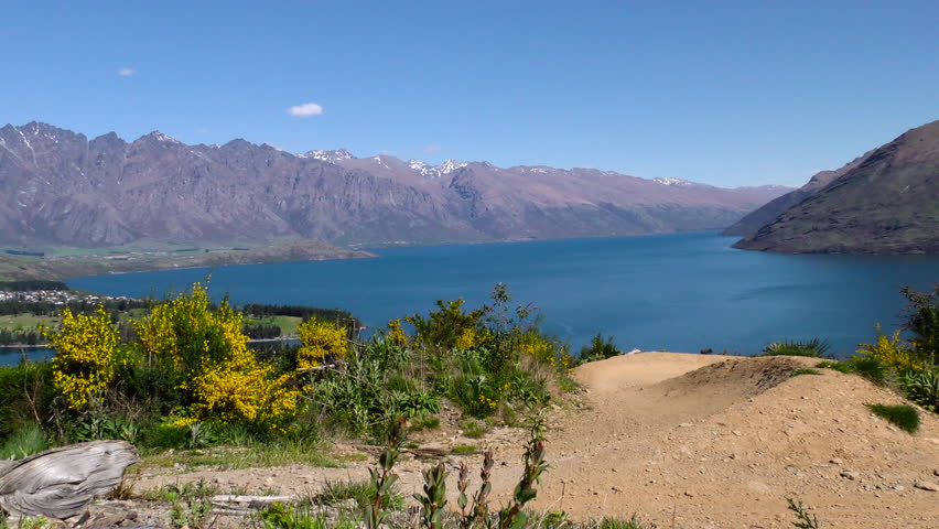 Mountain bike rider in Queenstown, New Zealand. Slow motion.