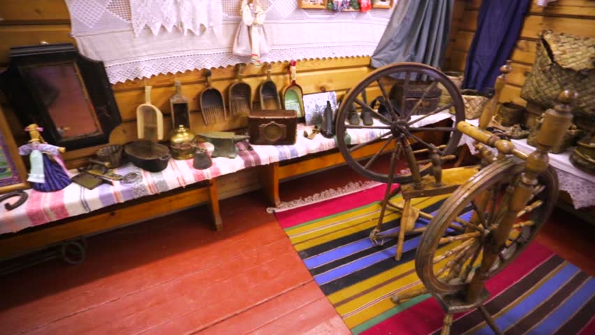 Old spinning wheels and other domestic articles in school museum in russian town Chupa.		