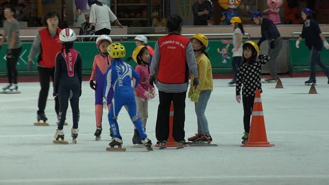 SEOUL, SOUTH KOREA - 9 OCTOBER 2015: A short track speed skating coach explains the trick of the game at an ice rink in Seoul, South Korea