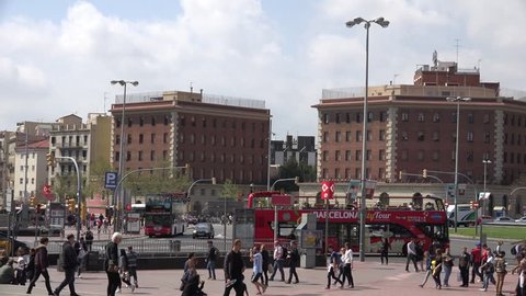 BARCELONA - SPAIN, APRIL 6, 2015, 4K Pan right, follow of touristic red bus in Placa Espanya by day