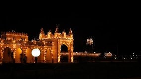 Pan shot of Mysore Palace lit up at night, Mysore, Karnataka, India