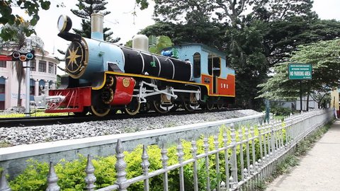 Pan shot of train engine at railroad station, Mysore, Karnataka, India
