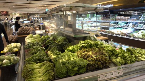SEOUL, SOUTH KOREA - 9 OCTOBER 2015: Water is sprayed on vegetables in a supermarket, giving them a fresh and tasty look, in Seoul, South Korea