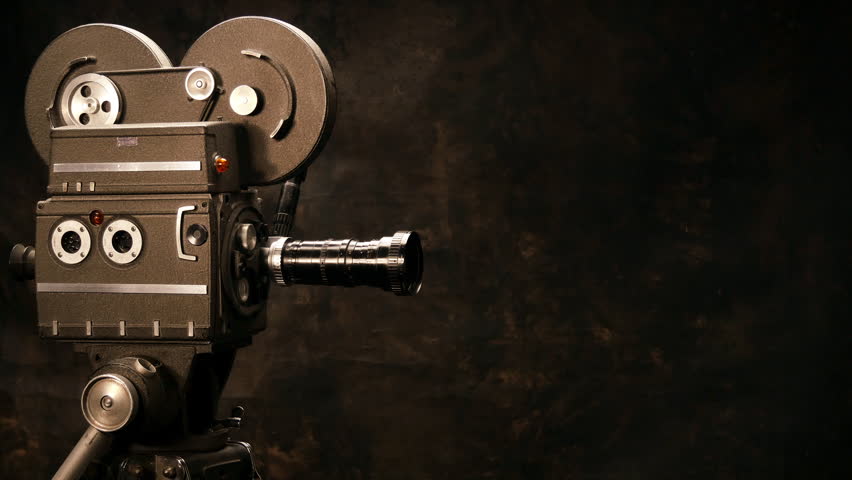 Vintage Hollywood Movie Camera in Front of Black Backdrop. Suitable for Tv Show, Film Title, or Credits. Royalty-Free Stock Footage #14759560