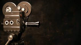 Vintage Hollywood Movie Camera in Front of Black Backdrop. Suitable for Tv Show, Film Title, or Credits.