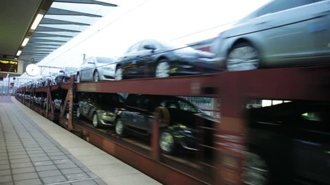 Brand new cars transported by railway from the factory to the store