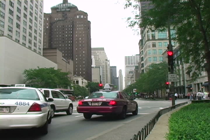 People and traffic moving on Chicago's Michigan Avenue.