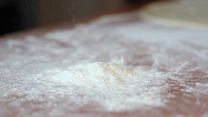 Dough falls onto the floured table | Shutterstock HD Video #14785672