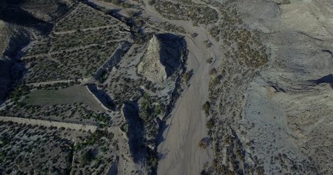 4K Aerial, Flight over a dry riverbed in a desert in Andalusia, Spain - Shot is straight out of the camera, no recompression. Watch for the graded and stabilzed versions in my portfolio
