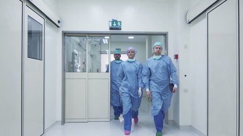 Team of Doctors and Nurses Walking through Hospital. Shot on RED Cinema Camera.