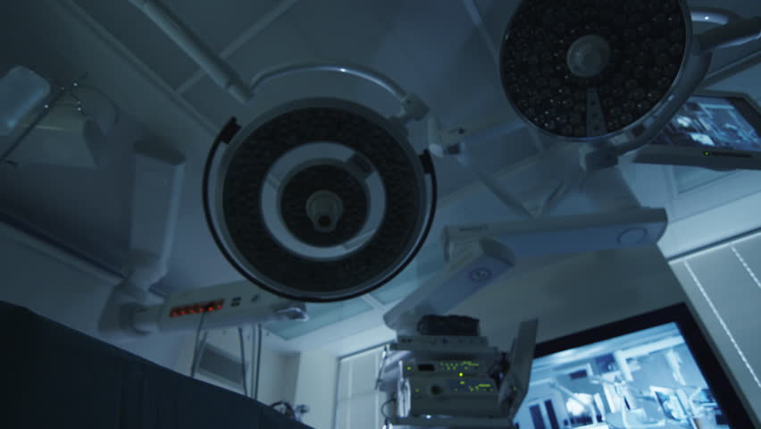Turning Lights On in Operating Room. Team of Doctors and Nurses over Patient. Patient Point of View. Shot on RED Cinema Camera. Royalty-Free Stock Footage #14791696