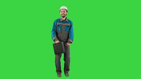 Funky and successful engineer, manager or architect dancing and having fun on a Green Screen, Chroma Key.