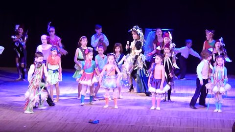 DNIPROPETROVSK, UKRAINE - FEBRUARY 23, 2016: Unidentified children, ages 4-13 years old, perform Once in the city… at the State Palace of children and youth.
